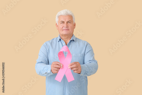 Mature man with pink ribbon...