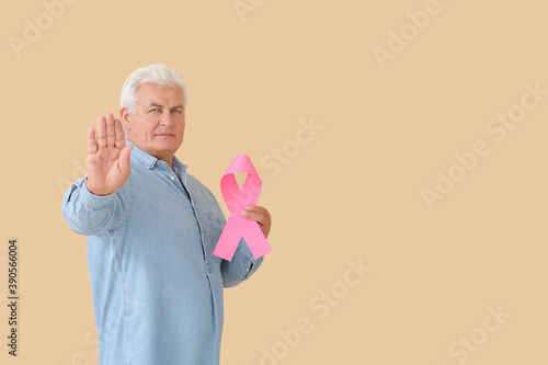 Mature man with pink ribbon...