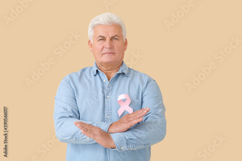 Mature man with pink ribbon...
