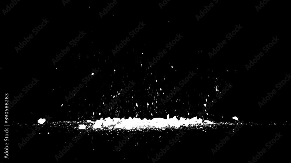 Blasted stone fragments and smoke, black background Blasted stone fragments and smoke, black background