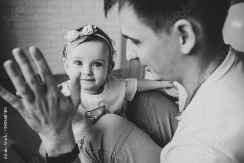 Father play with daughter at home. Sincere emotions concept. Happy family holidays. black and white photo.