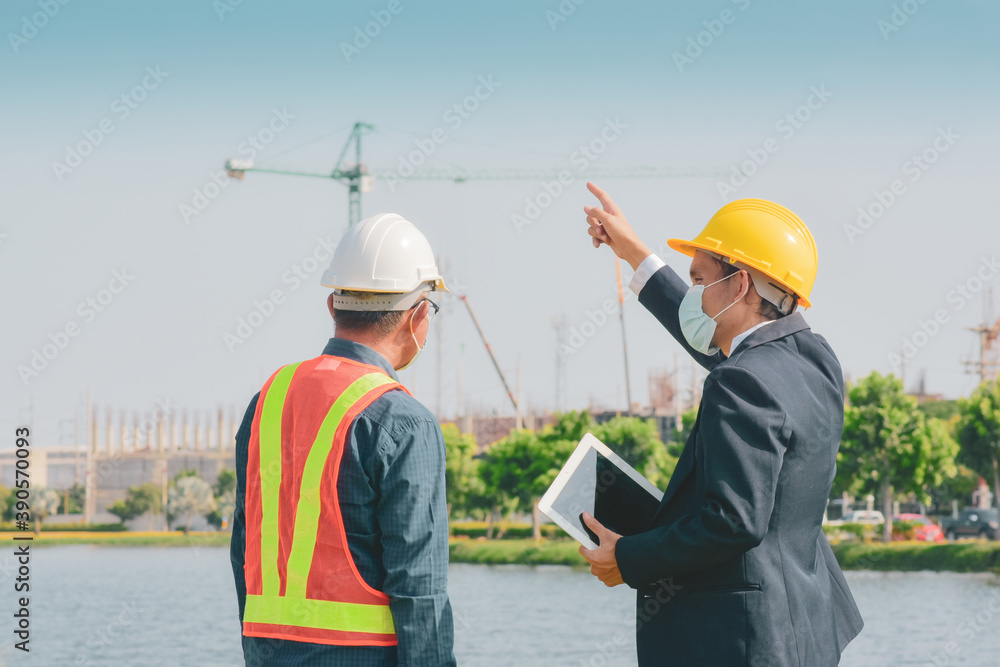 Engineer building home estate outdoor.And Man wear face mask protect coronavirus Covid19 Engineer building home estate outdoor.And Man wear face mask protect coronavirus Covid19