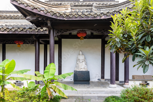 Statue of Shen Kuo in pavilion at Dream Pool or Mengxi Park in Zhenjiang, Jiangsu, China, former residence of Shen Kuo, Chinese polymathic scientist in Song dynasty in 11th CE. photo