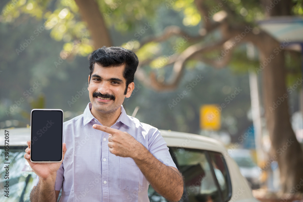 Indian young man showing digital tabtel Indian young man showing digital tabtel