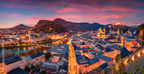 Spectacular evening cityscape of Salzburg town. Colorful autumn scene of Eastern Alps. Splendid landscape with Salzach river. Traveling concept background.