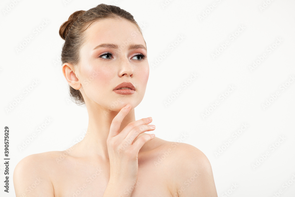 Portrait of a beautiful young woman with clean skin and makeup on a white background Portrait of a beautiful young woman with clean skin and makeup on a white background