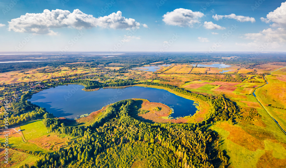 Bright morning view from flying drone of Pishchans'ke lake. Sunny summer scene on Shatsky National Park, Volyn region, Ukraine, Europe. Traveling concept background.