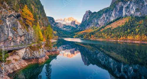 View from flying drone of Gosausee (Vorderer) lake with Dachstein glacieron background. Attractive evening scene of Austrian Alps, Upper Austria, Europe. Beauty of nature concept background..