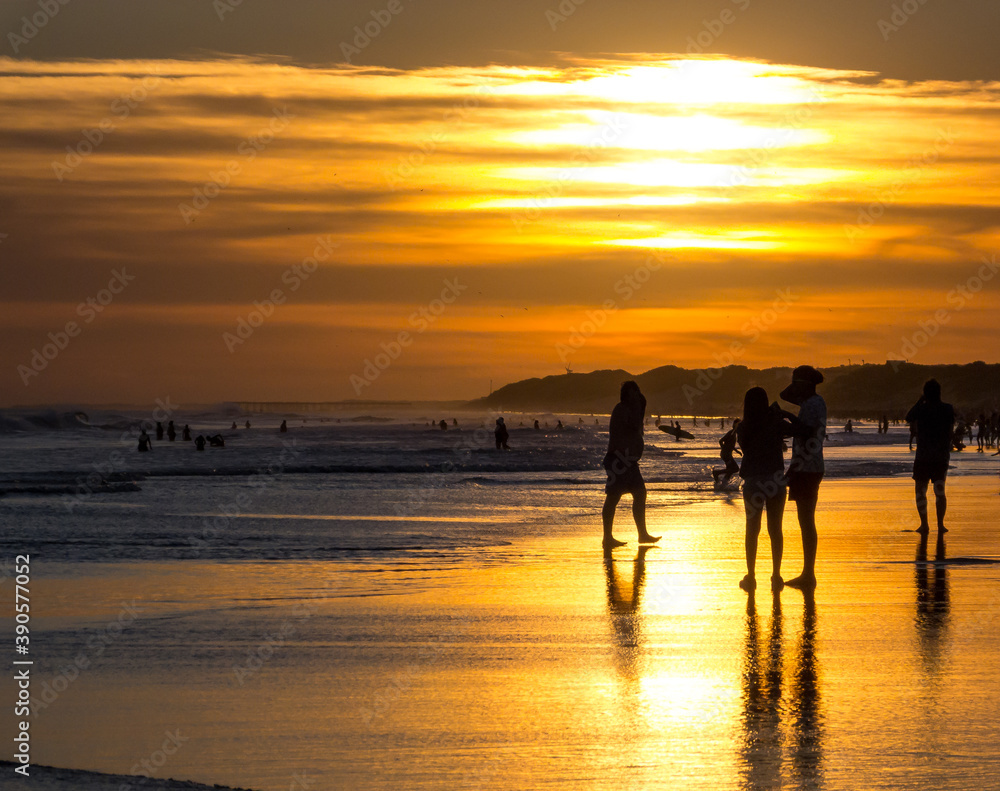 Silhouettes in the sunset at the beach Silhouettes in the sunset at the beach