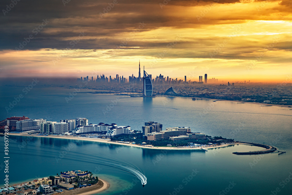Dubai - Amazing city center skyline and famous Jumeirah beach and Palm Jumeirah in the morning, United Arab Emirates