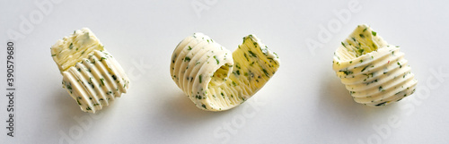 Three elegant spiral butter curls on white photo