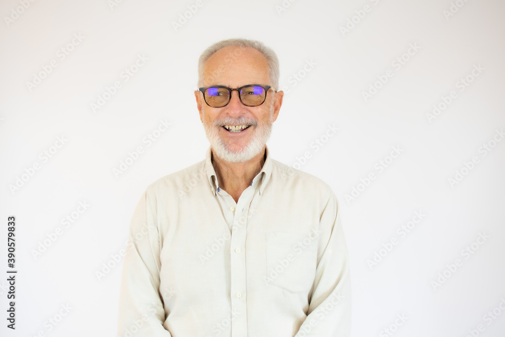 Portrait of cheerful senior man who is looking at camera and smiling over white background. Portrait of cheerful senior man who is looking at camera and smiling over white background.