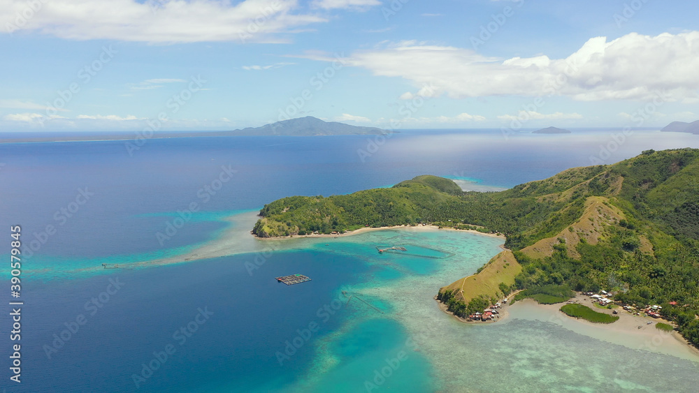 Seascape with tropical islands and turquoise water. Sleeping dinosaur island located on the island of Mindanao, Philippines.