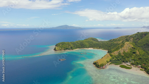 Seascape with tropical islands and turquoise water. Sleeping dinosaur island located on the island of Mindanao  Philippines.