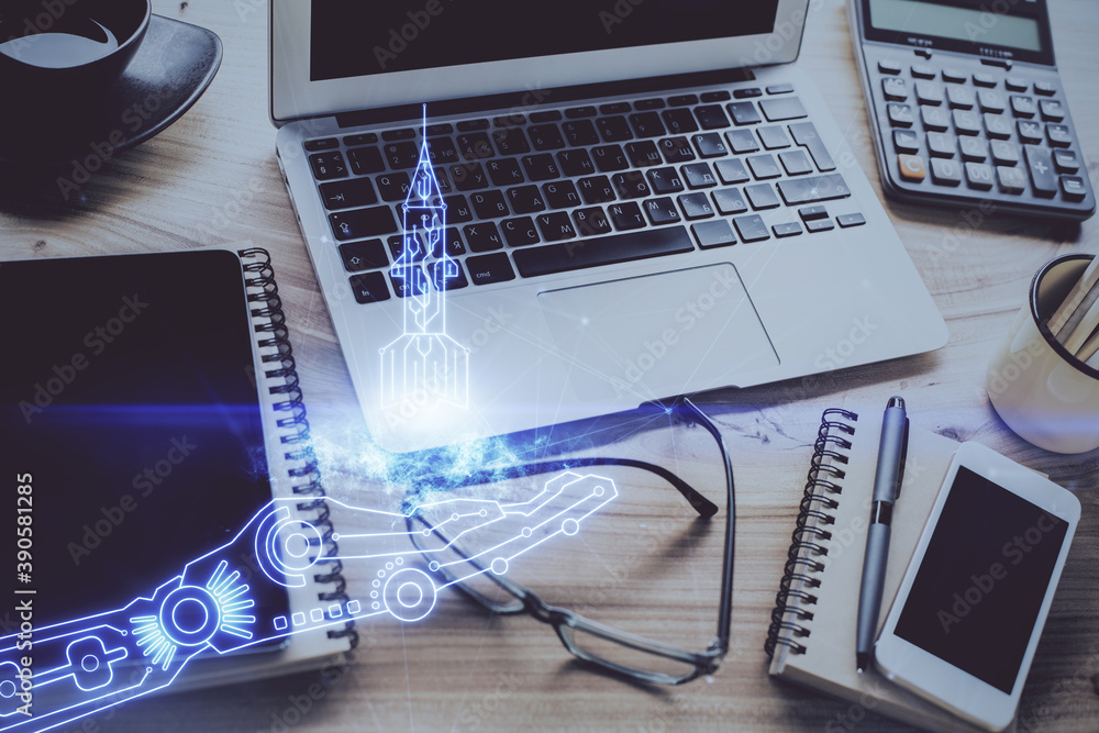 Desktop computer background in office and start up theme hologram drawing. Double exposure. Startup concept. Desktop computer background in office and start up theme hologram drawing. Double exposure. Startup concept.
