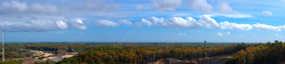 Aerial Panoramic View Cloudscape over Active Quarry in the Forest