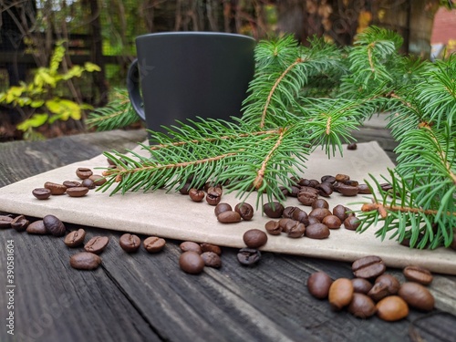 a cup of coffee and a spruce branch