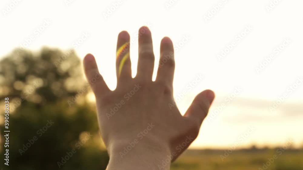 Glare of the evening sun through fingers Glare of the evening sun through fingers