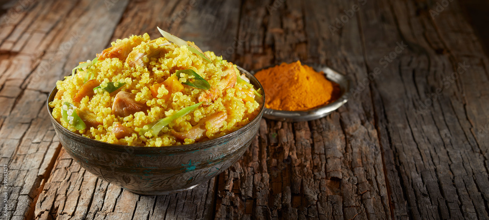 Heaped bowl of savory quinoa and couscous Heaped bowl of savory quinoa and couscous