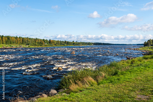 Downstream kukkola rapid in Torne river Norrbotten Sweden photo