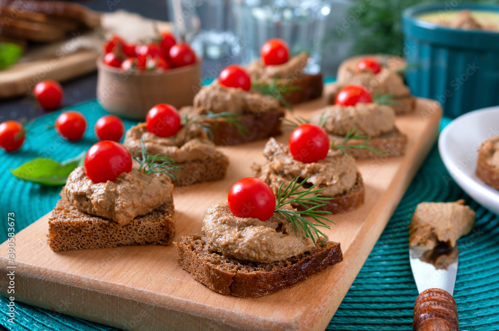 Canapes with rye bread, liver pate, cherry tomatoes. Breakfast snack.