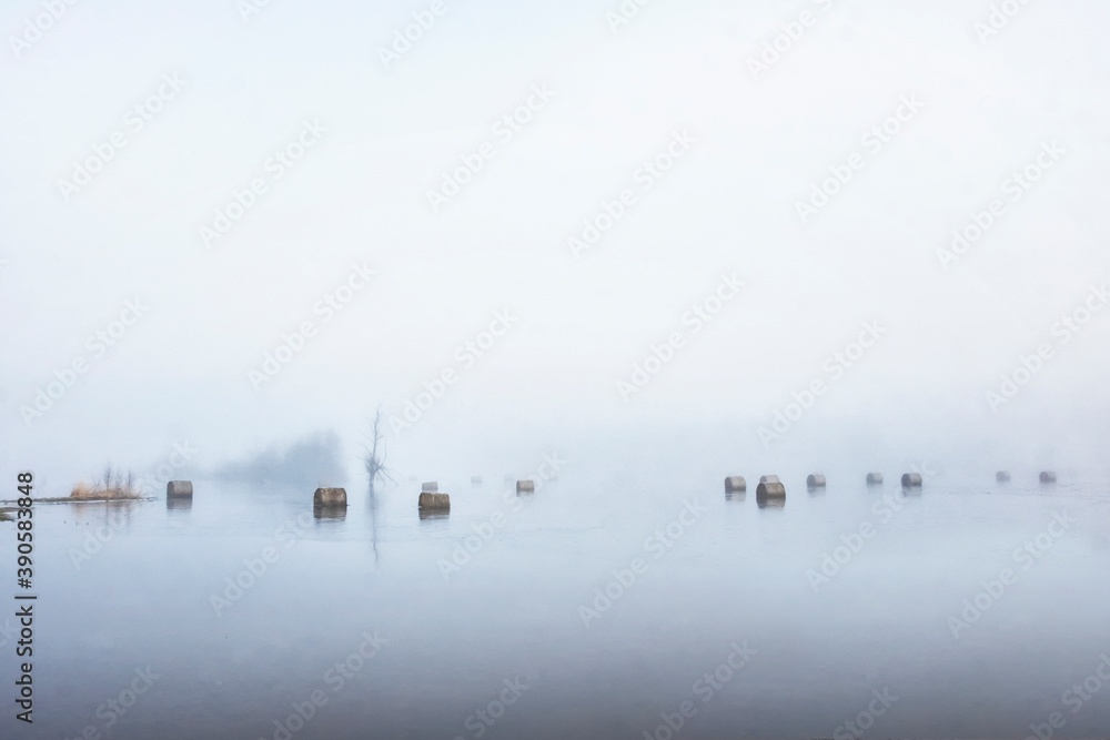 hay rolls in water and morning fog hay rolls in water and morning fog