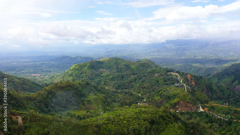 Lush green rainforest in the mountains. Aerial drone view of the jungle located on the island of Mindanao, Philippines. Lush green rainforest in the mountains. Aerial drone view of the jungle located on the island of Mindanao, Philippines.