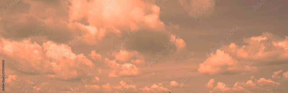 Toned cloudscape. Blue gray sky with orange pink clouds. Dramatic sky background.