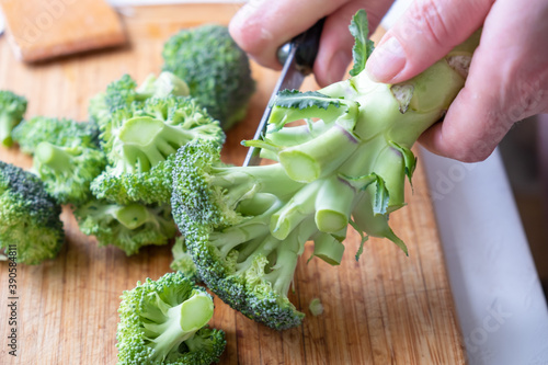 Fresh green broccoli on a wooden cutting board. Macro photo green fresh vegetable broccoli.