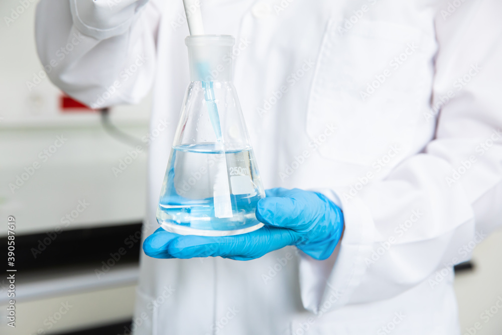 Scientist working in medical technology research laboratory with test tube. Chemist or biogenetic doctor working on coronavirus, covid-19 vaccine. Scientist working in medical technology research laboratory with test tube. Chemist or biogenetic doctor working on coronavirus, covid-19 vaccine.