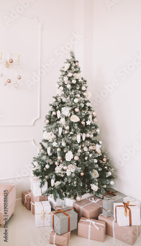Christmas home interior. Christmas tree toys and gifts. New Year home decorations © paralisart