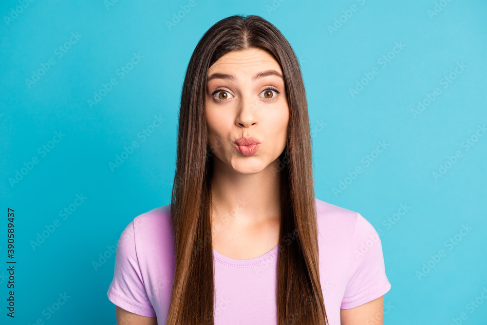 Photo portrait of coquettish woman dressed casual purple t-shirt kissing you isolated blue color background Photo portrait of coquettish woman dressed casual purple t-shirt kissing you isolated blue color background
