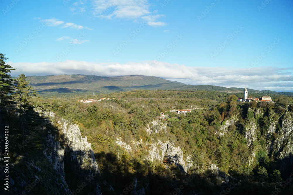 Skocjan village in Škocjan Caves Regional Park, mountains in Slovenia, October 2016 Skocjan village in Škocjan Caves Regional Park, mountains in Slovenia, October 2016