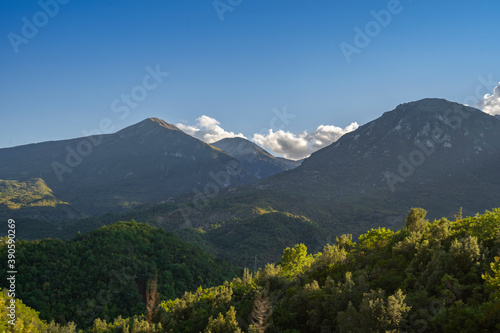 Beautiful sunrise over wild forest  mountains in summer