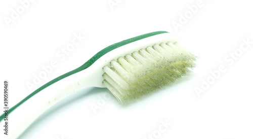 A dirty  unused old toothbrush.