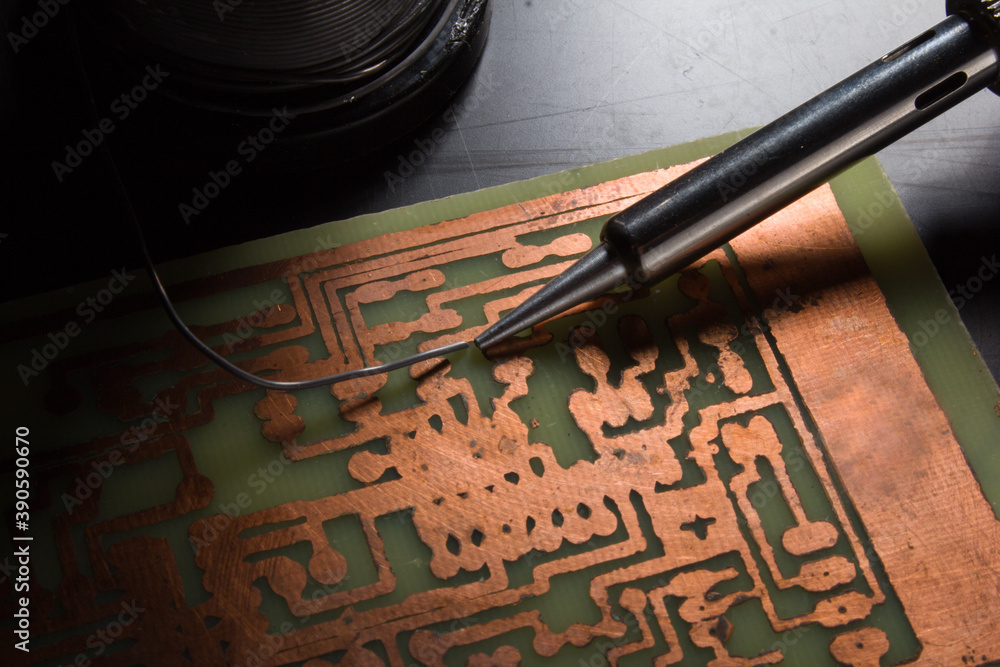 use a soldering iron to solder the electronic part to the Board. Computer repair. .