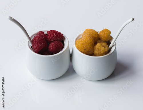 Raspberry red and yellow in ceramic bowls