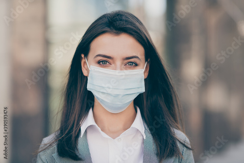 Photo of attractive young business person work in pandemic wear medical mask protection in outdoors