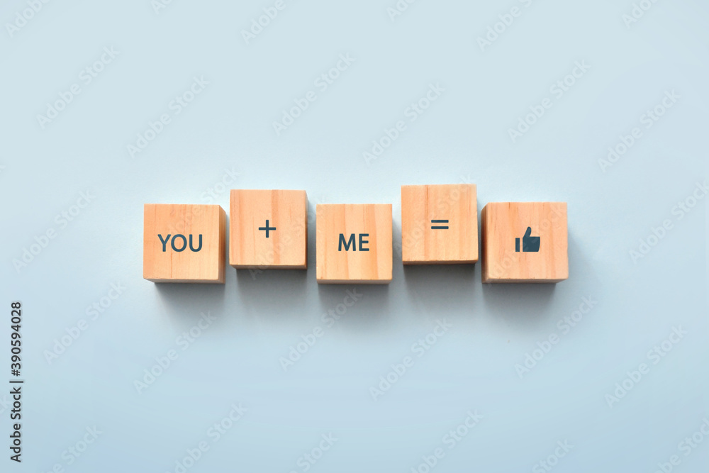 Wooden cubes with the inscription: you and me - it's beautiful. Love and friendship in relationships Wooden cubes with the inscription: you and me - it's beautiful. Love and friendship in relationships