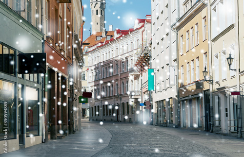 architecture and urban concept - empty street of Tallinn city old town over snow