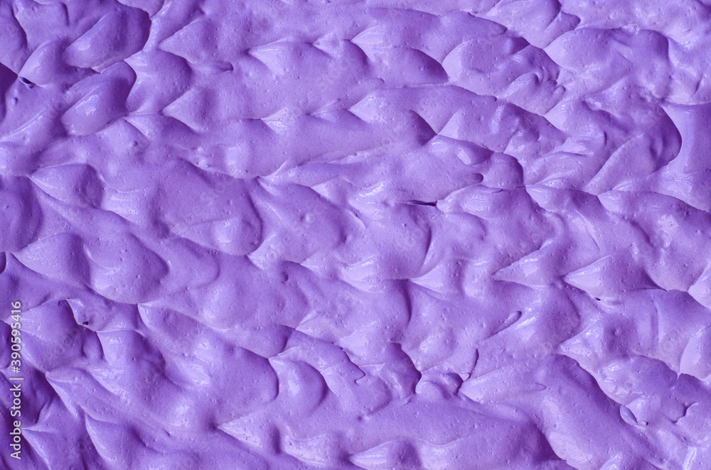 Purple clay (alginate face mask, body wrap, hair conditioner) texture close up, selective focus. Abstract lavender background with brush storkes.