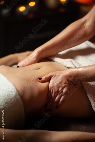 Beautiful young woman receiving massage in spa salon © alipko
