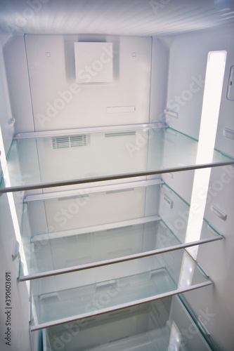 Empty Cold Refrigerator Interior With Trays