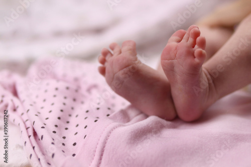 infant, Newborn baby's feet on blanket closeup. Selective focus