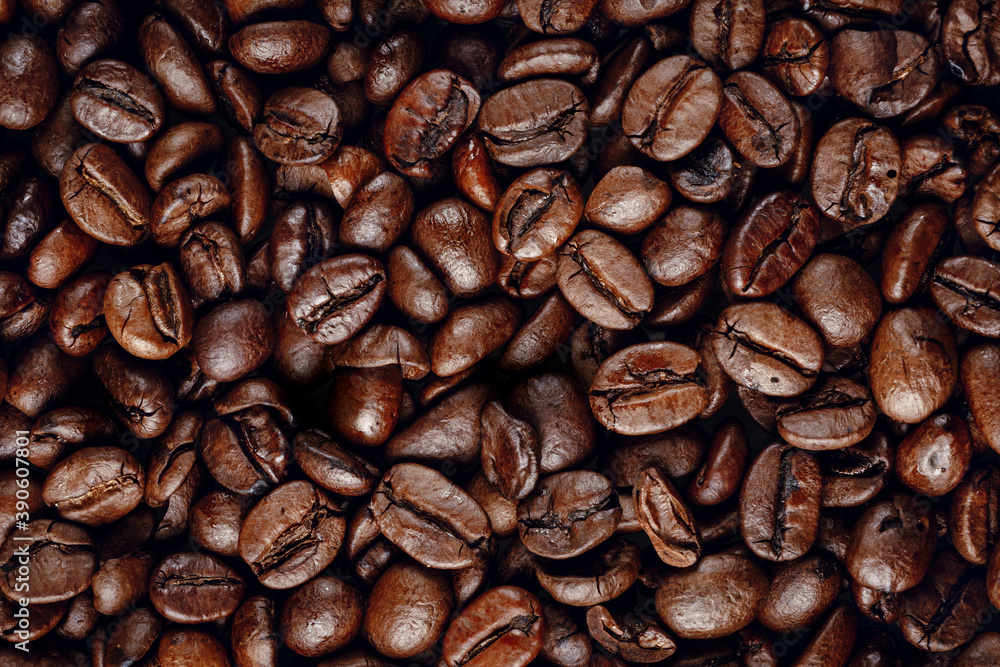 Fototapeta premium Coffee beans close up on a black background