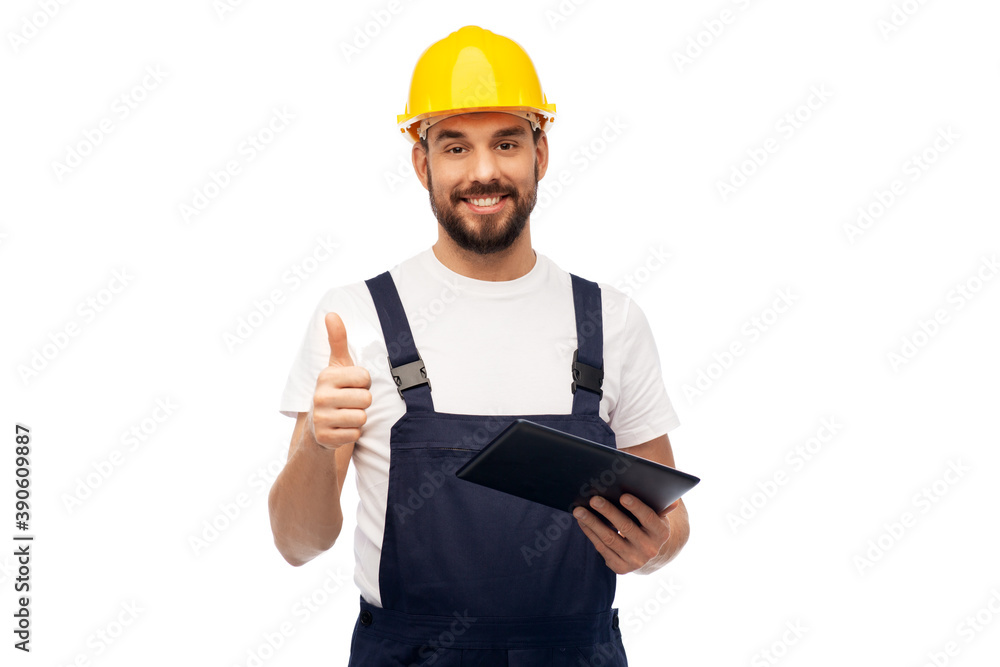 profession, construction and building - happy smiling male worker or builder in yellow helmet and overall with tablet pc computer showing thumbs up over white background profession, construction and building - happy smiling male worker or builder in yellow helmet and overall with tablet pc computer showing thumbs up over white background