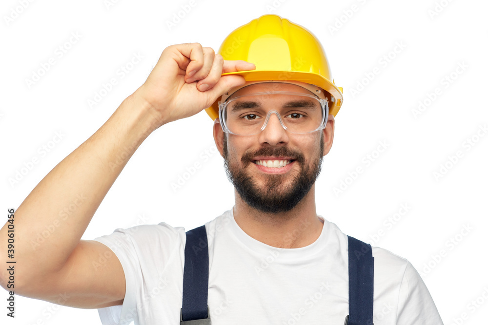 profession, construction and building - happy smiling male worker or builder in yellow helmet and overall over white background