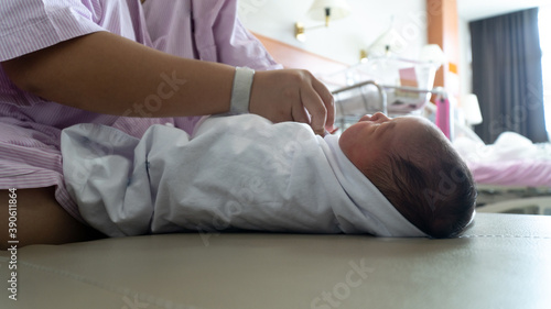 New Born Baby Girl is New Born Baby GIrl Being Wrapped
