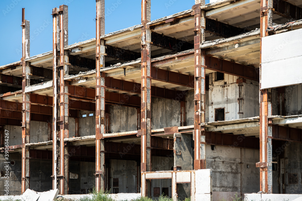 Unfinished and abandoned building in the section. You can see the frame of the building and its internal structure. The building is slowly being destroyed. Unfinished and abandoned building in the section. You can see the frame of the building and its internal structure. The building is slowly being destroyed.