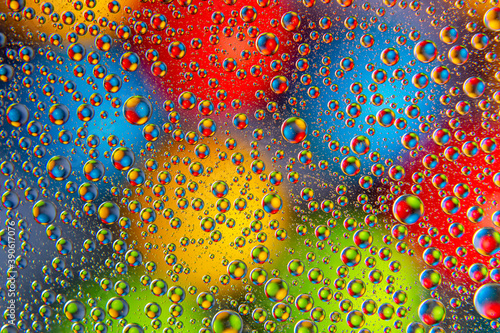 colored drops of water on glass. abstract background texture